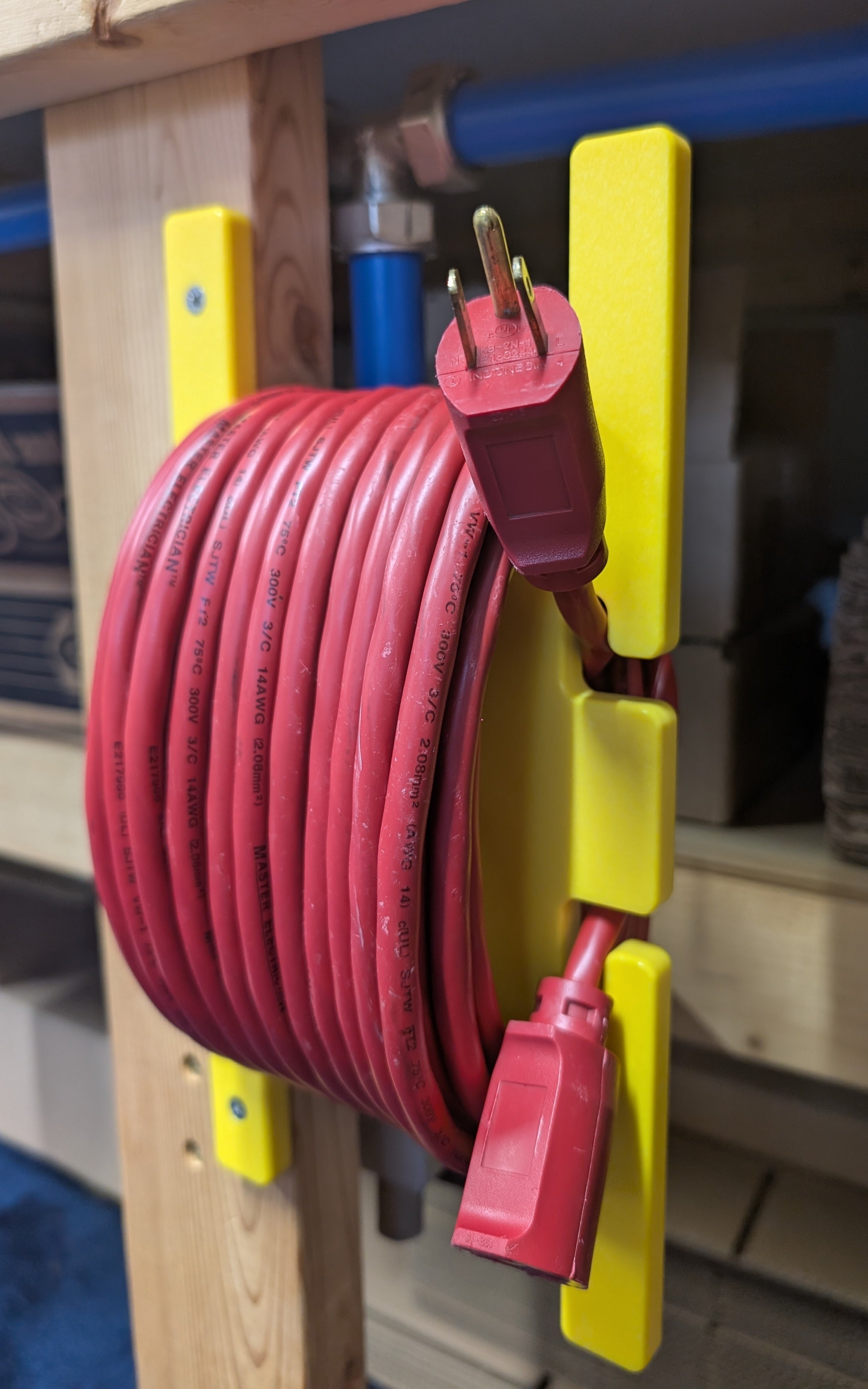 Yellow HDPE extension cord reel holder for 100 ft cords by Cauff